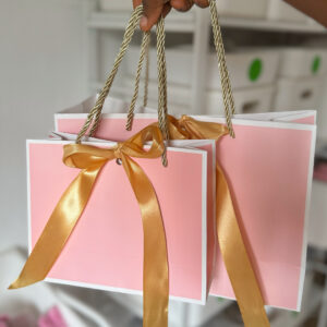 Pink and white plain paper bag