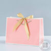 Pink and white plain paper bag